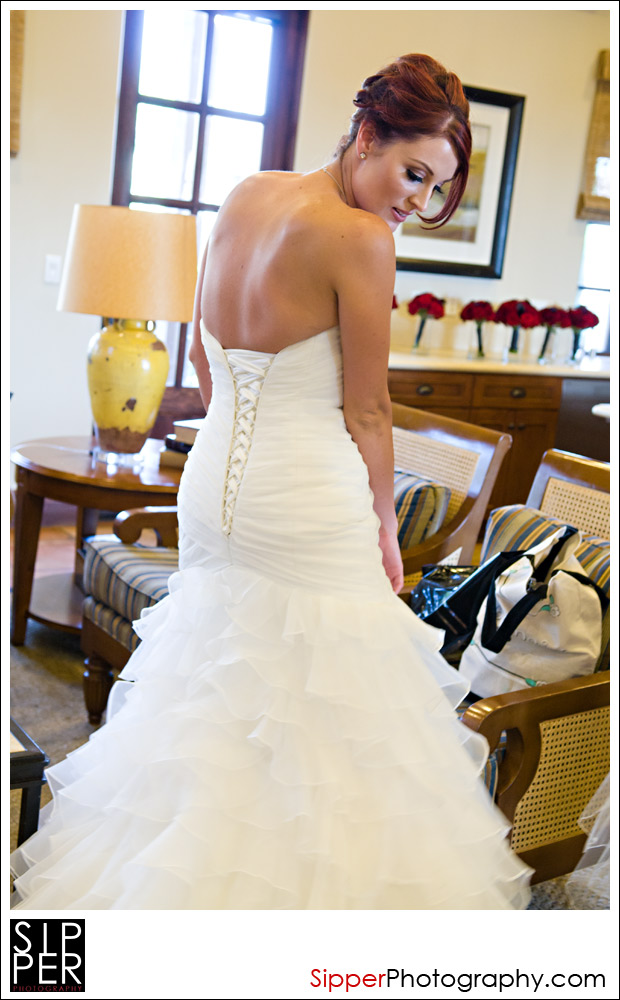 Bride getting ready in her wedding dress