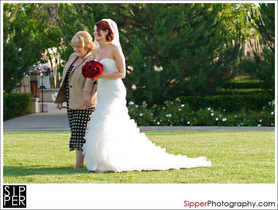 Bride walking with her mom
